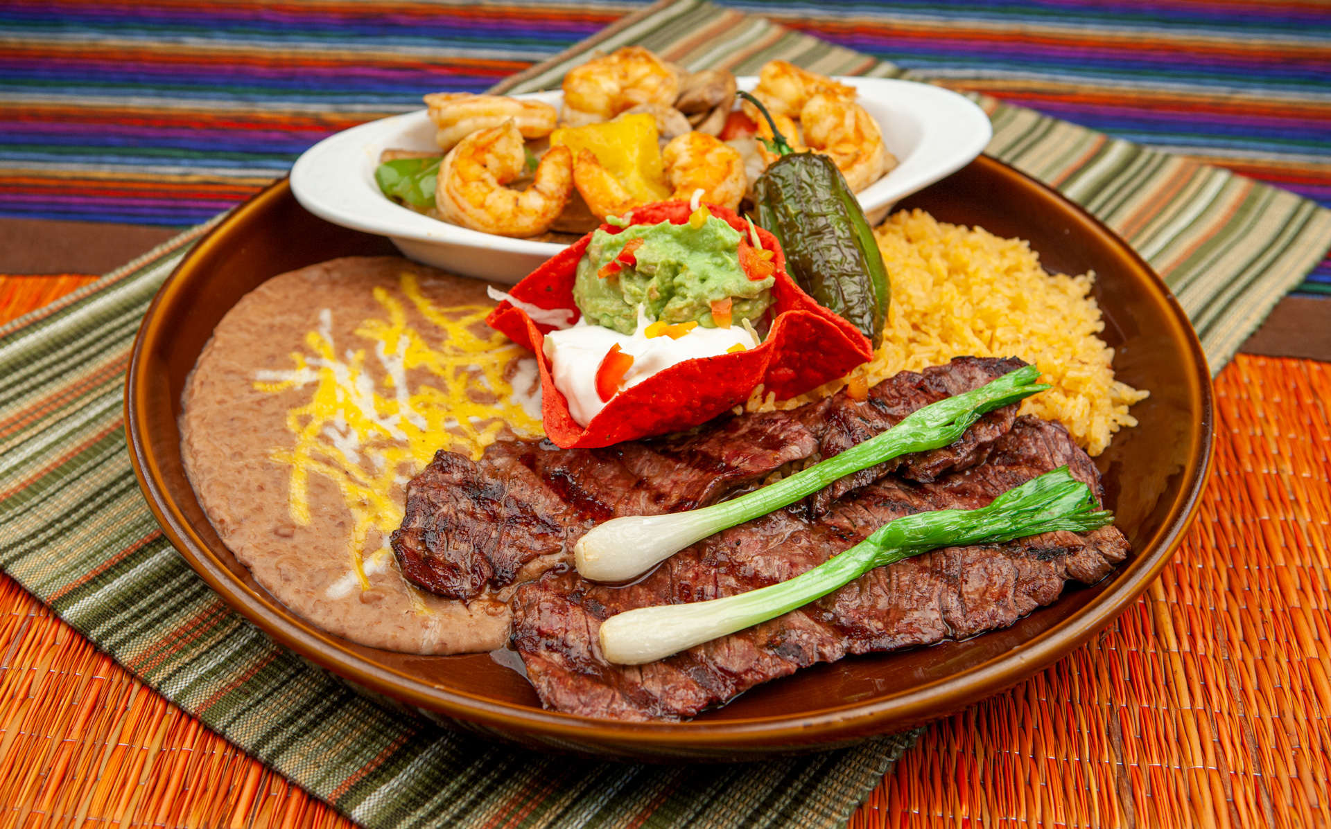 Toreros grilled steak and shrimp with rice, beans, and fresh guacamole